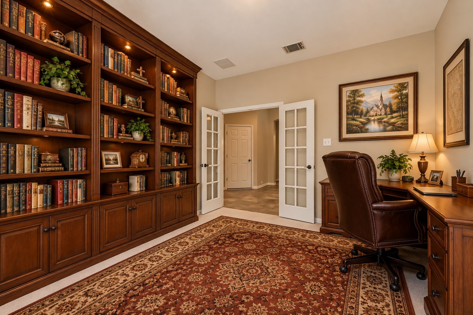 30910 Blue Ridge Park Lane Spring, TX 77386 - Photo 32 of 50 A beautifully staged study invites productivity with its rich wood bookshelves, elegant decor, and a sophisticated desk setup, all enhanced by AI virtual staging.