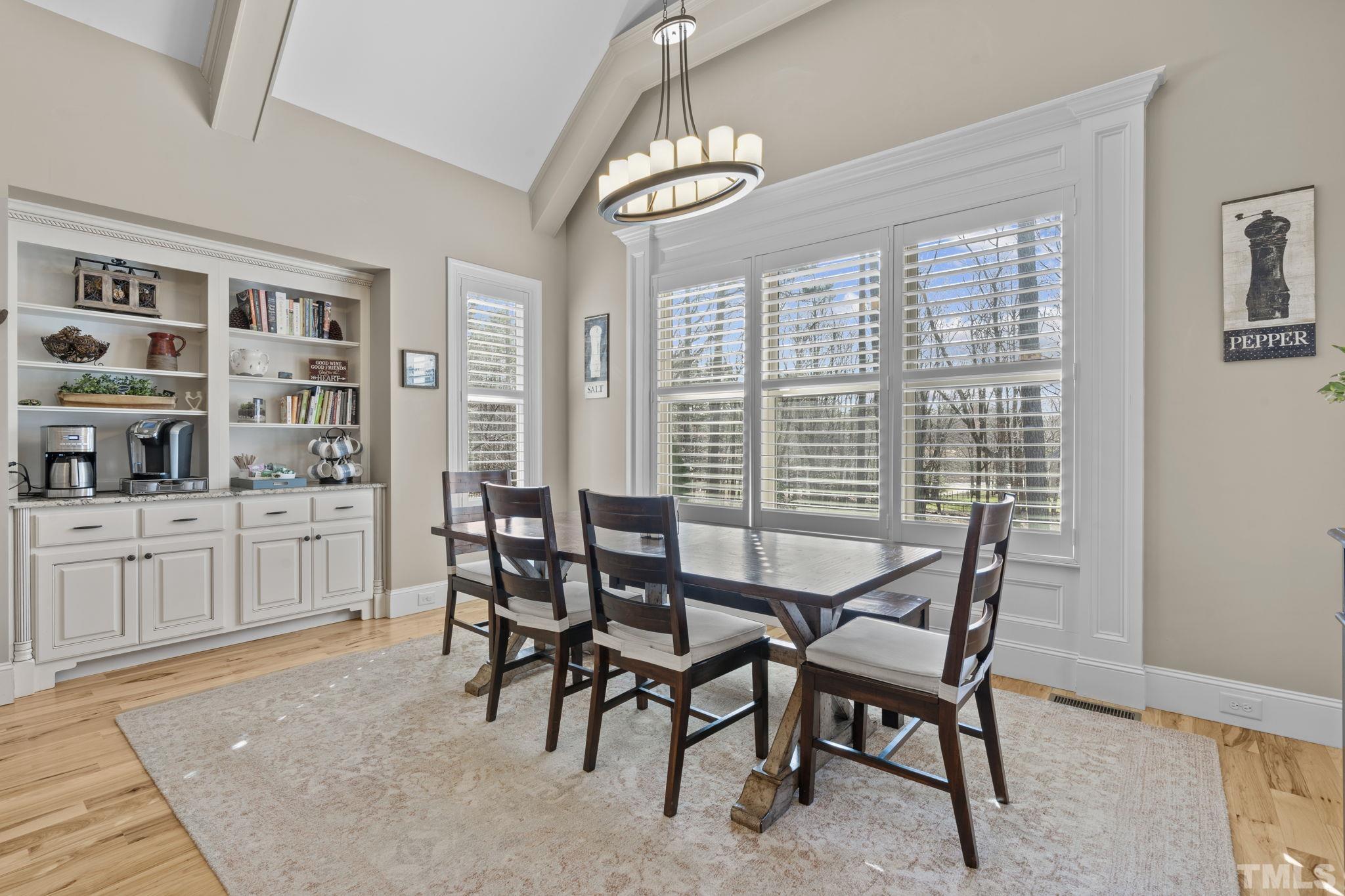 3976 Springfield Trail Wake Forest, NC 27587 - Photo 13 of 35 a dining room with furniture and window