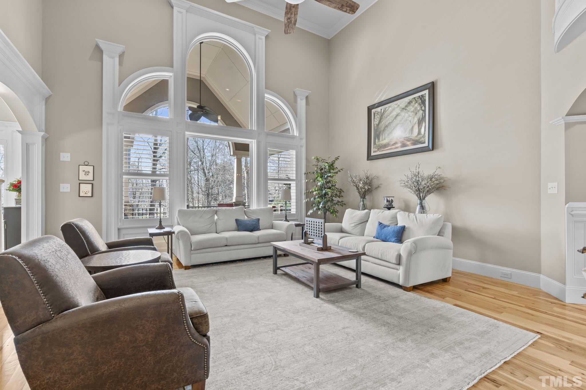 3976 Springfield Trail Wake Forest, NC 27587 - Photo 15 of 35 a living room with furniture or couch and a large window