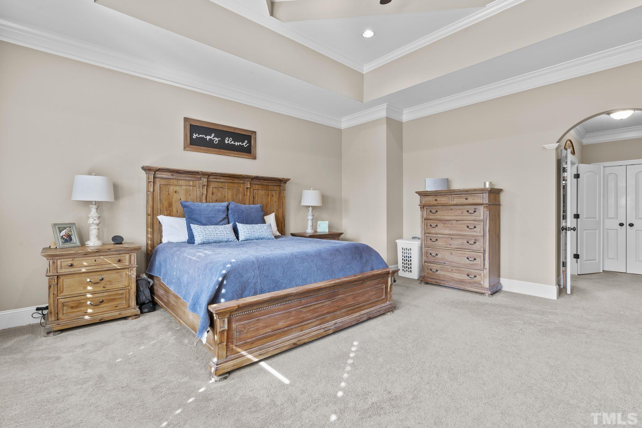 3976 Springfield Trail Wake Forest, NC 27587 - Photo 18 of 35 a bedroom with a bed and cabinets