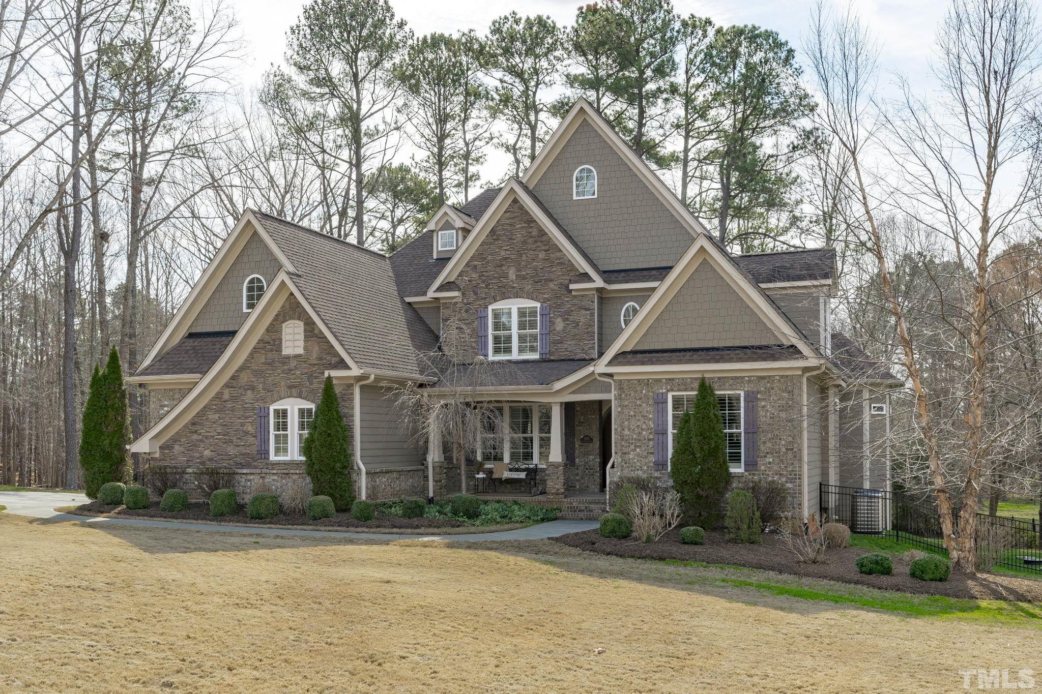 3976 Springfield Trail Wake Forest, NC 27587 - Photo 2 of 35 front view of a house with a yard