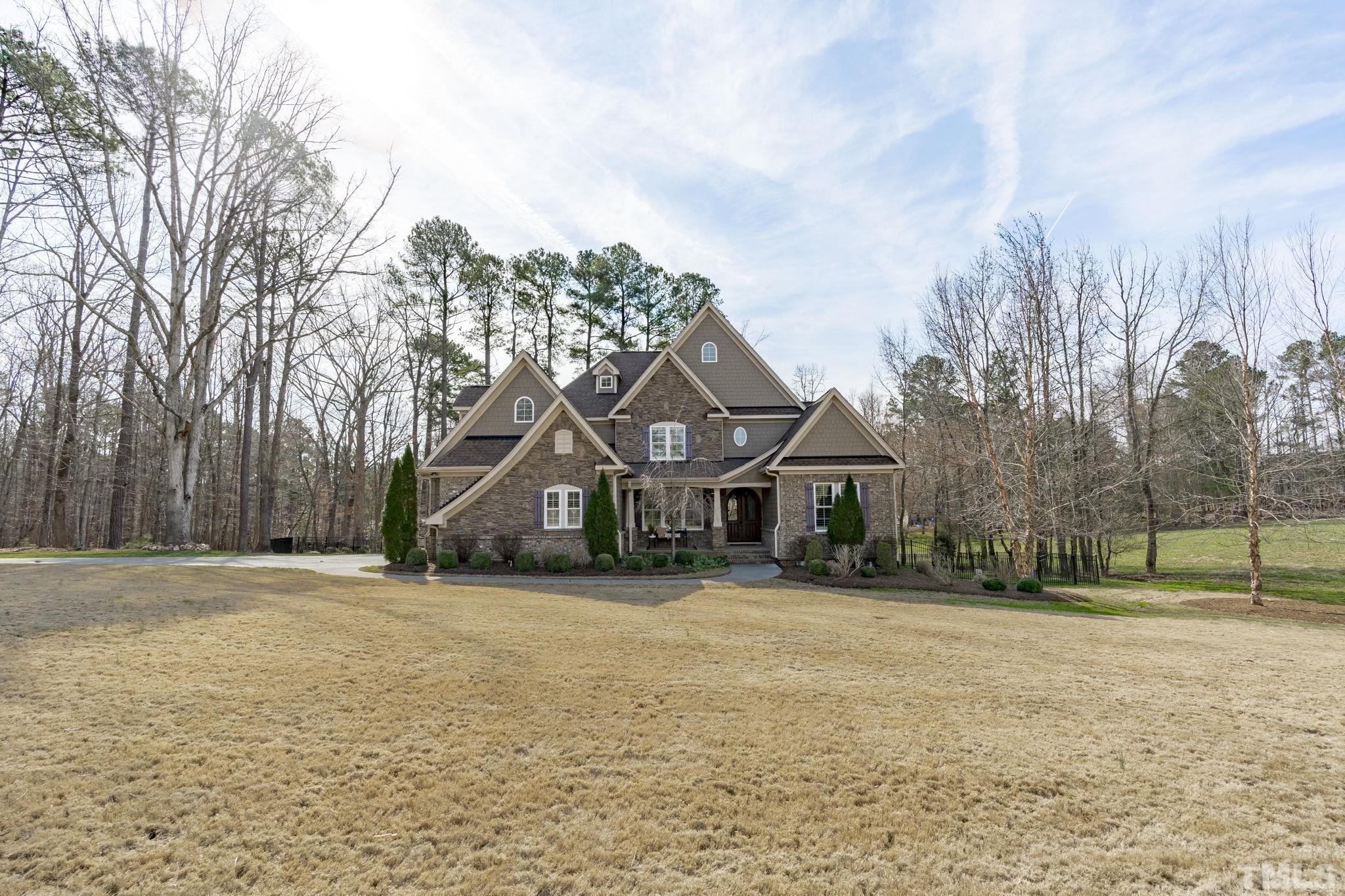 3976 Springfield Trail Wake Forest, NC 27587 - Photo 3 of 35 a front view of house with yard and trees