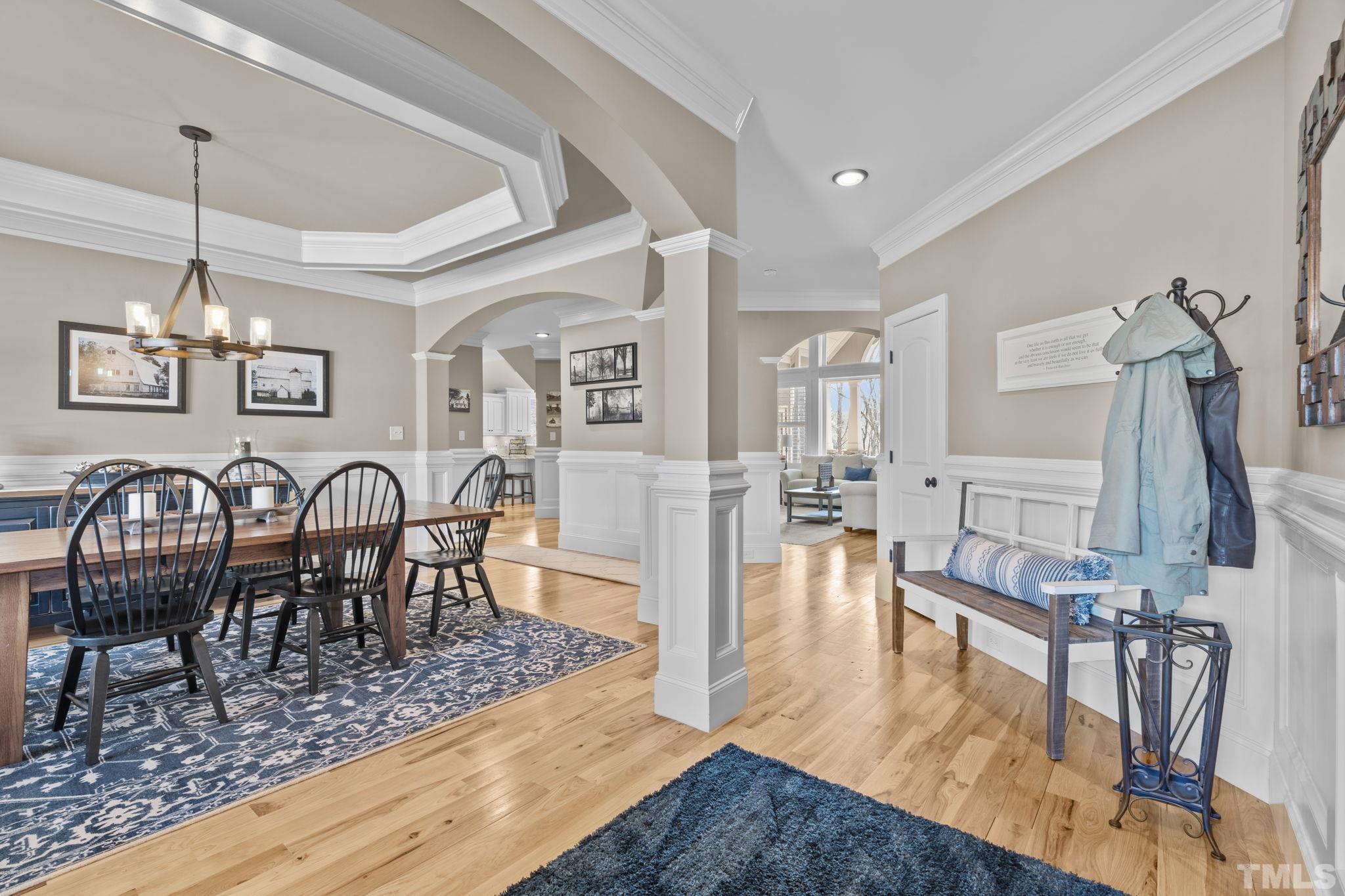 3976 Springfield Trail Wake Forest, NC 27587 - Photo 5 of 35 a view of a a dining room with furniture a rug and wooden floor