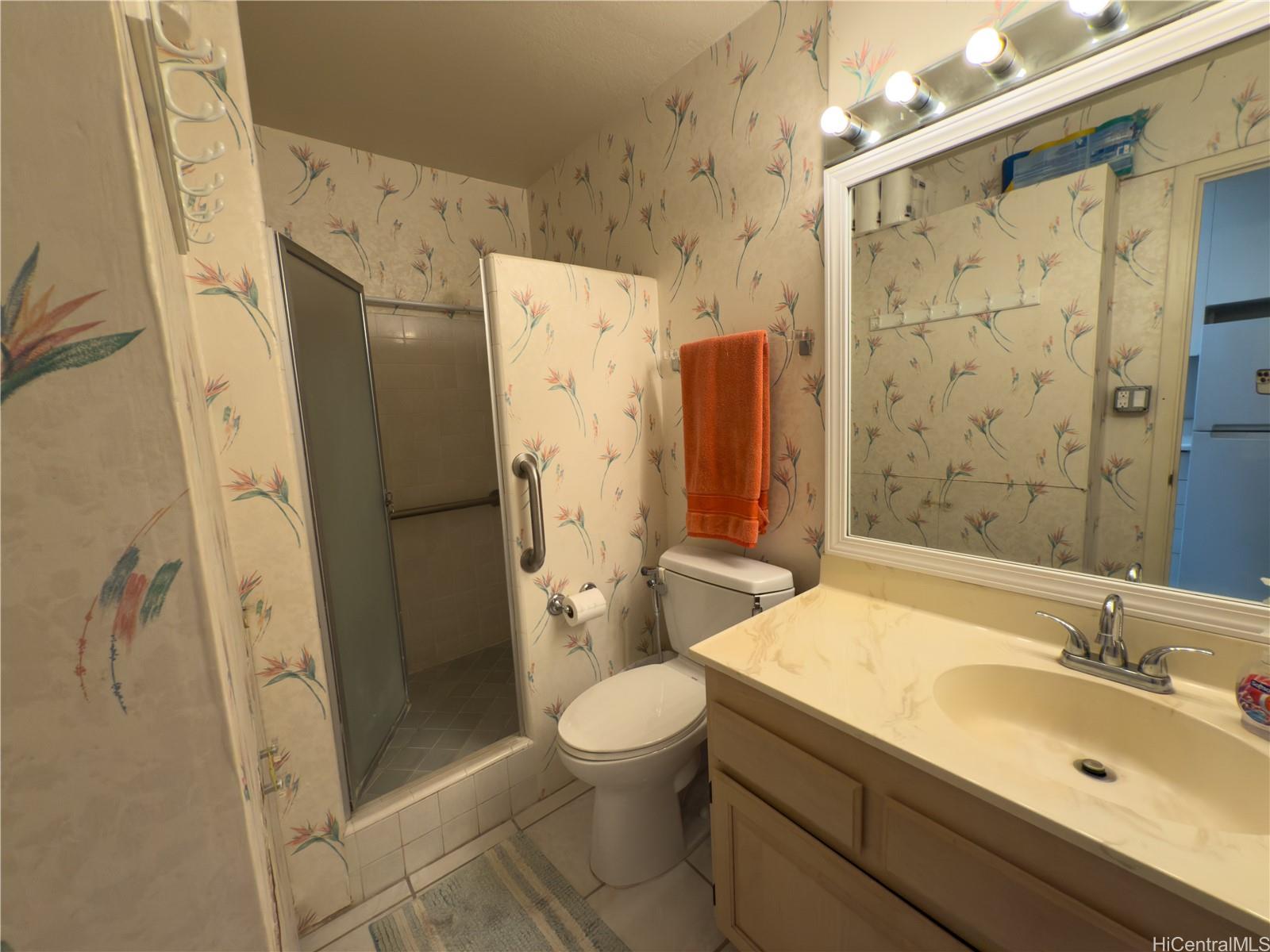 425 Ena Road, Unit 1201B Honolulu, HI 96815 - Photo 11 of 20 a bathroom with a sink toilet and shower