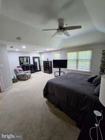 a bed room with a bed and gym equipment