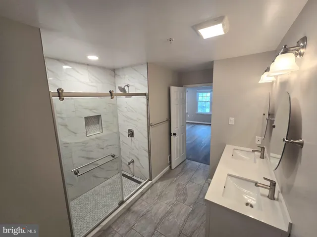 a bathroom with a sink and shower