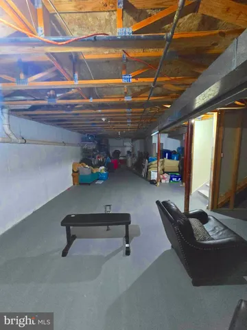 an outdoor sitting area with the couch and chairs