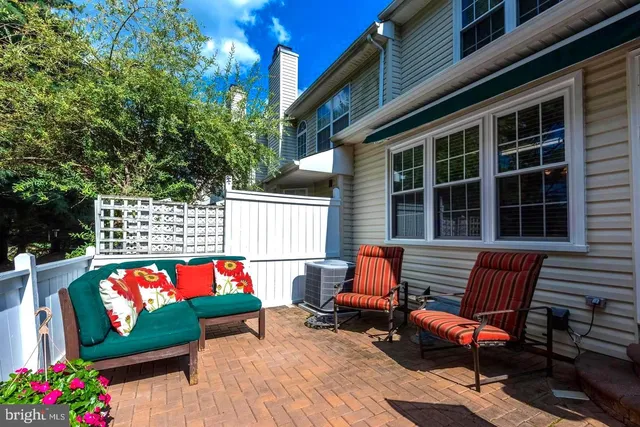 a sign that is sitting in front of a brick building