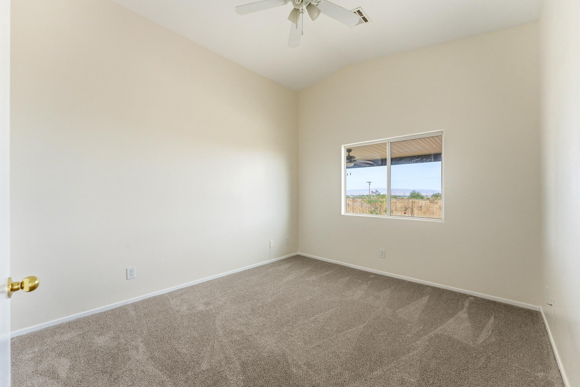2776 Leto Avenue Thermal, CA 92274 - Photo 22 of 44 an empty room with a window