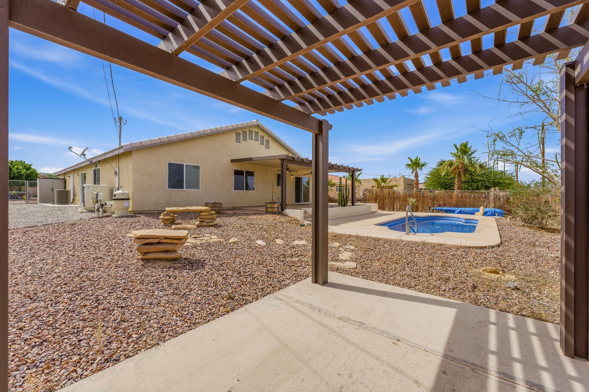 2776 Leto Avenue Thermal, CA 92274 - Photo 35 of 44 a backyard of a house with table and chairs