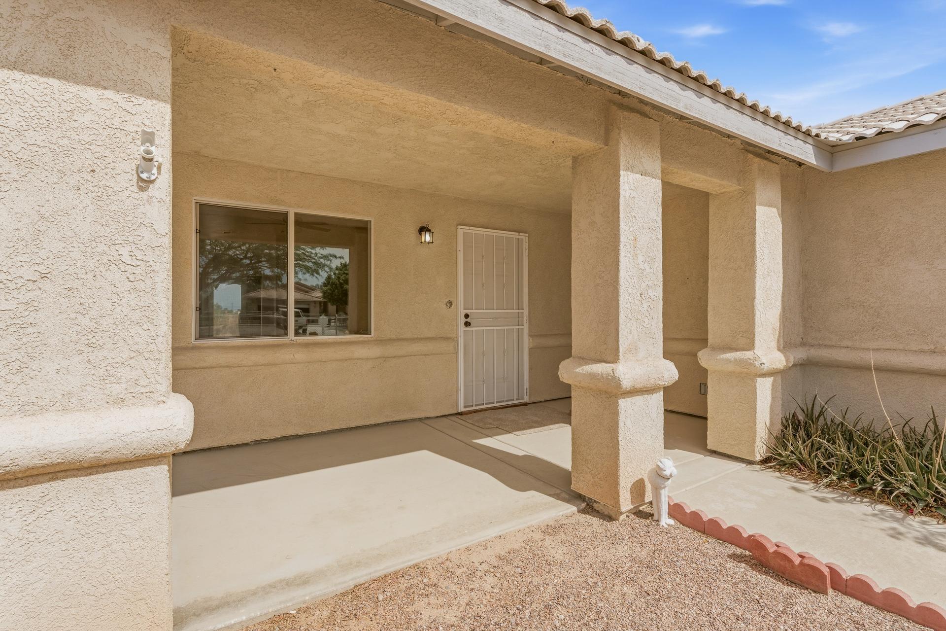 2776 Leto Avenue Thermal, CA 92274 - Photo 8 of 44 a front view of a house with outdoor seating