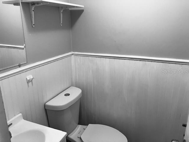 3841 Chaffey Drive New Port Richey, FL 34652 - Photo 13 of 18 a white toilet sitting next to a shower