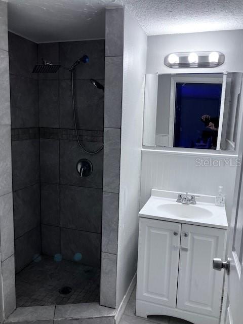 3841 Chaffey Drive New Port Richey, FL 34652 - Photo 15 of 18 a bathroom with a sink vanity granite shower and mirror