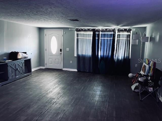 3841 Chaffey Drive New Port Richey, FL 34652 - Photo 2 of 18 a view of empty room with wooden floor