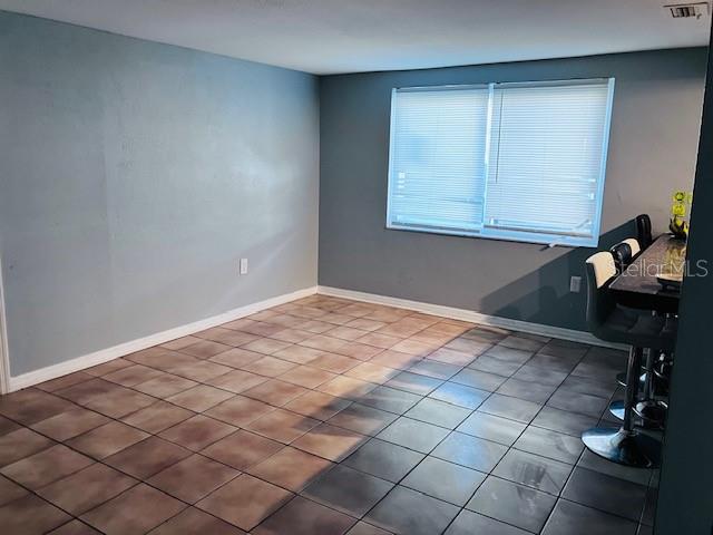 3841 Chaffey Drive New Port Richey, FL 34652 - Photo 6 of 18 a bedroom with a bed and a window