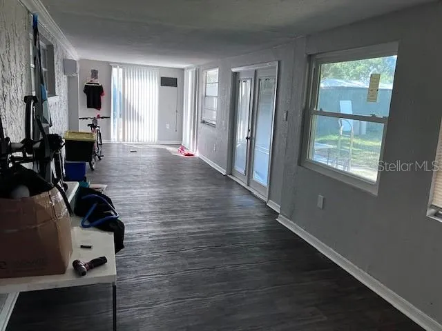 a view of a livingroom with furniture window and wooden floor
