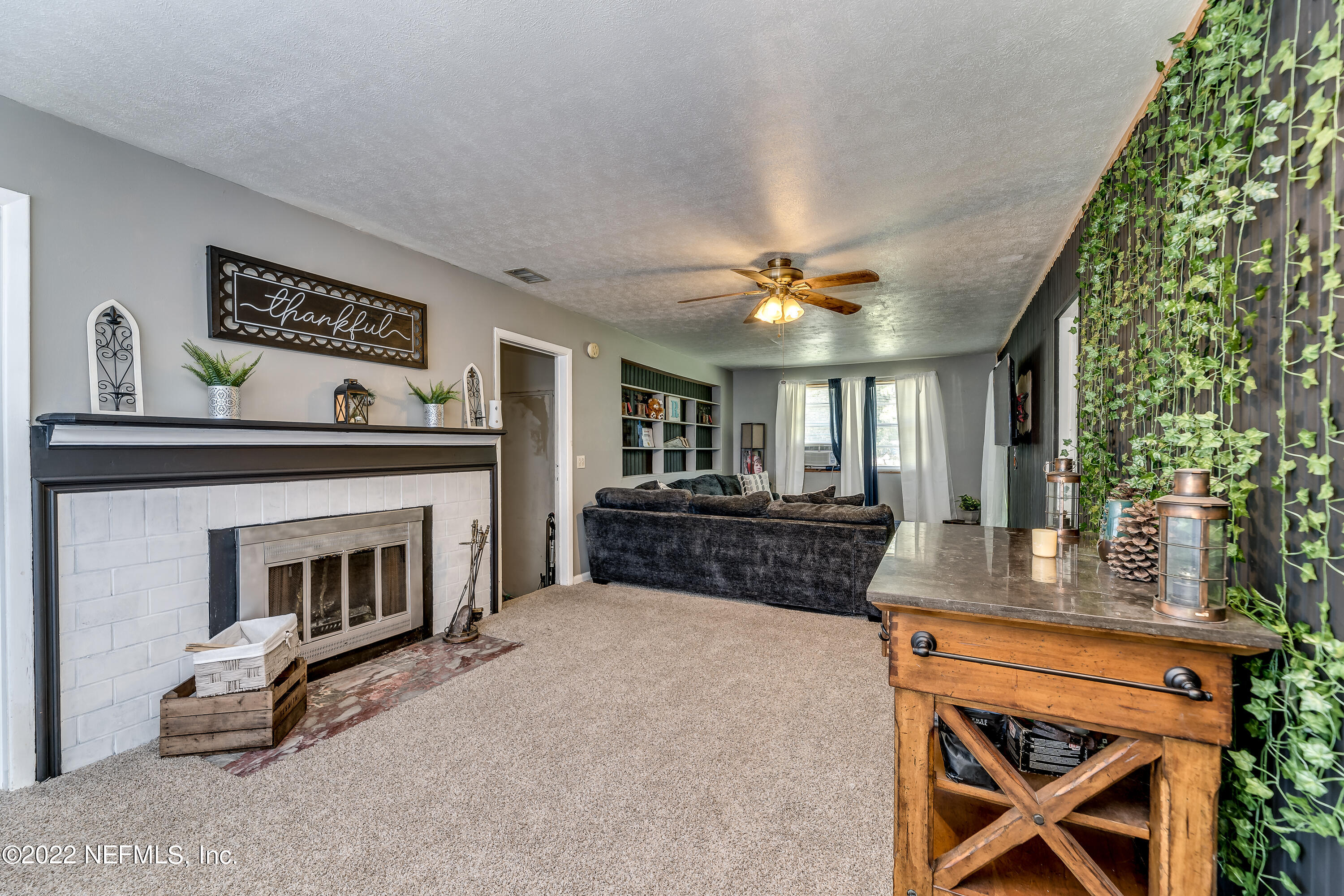 2149 Chaffee Road South Jacksonville, FL 32221 - Photo 8 of 19 a living room with furniture and a fireplace