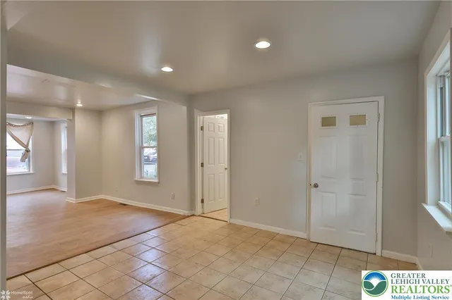 a bathroom with a sink mirror and toilet