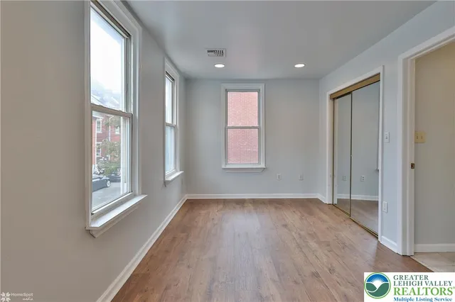 a view of deck with two couches and wooden floor