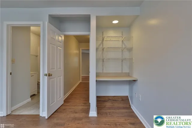 a view of a deck with a large window and wooden fence