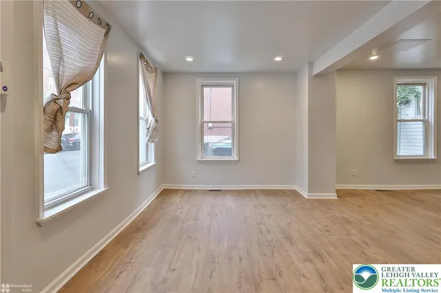 a view of an empty room and window