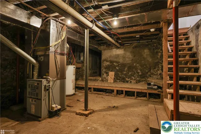 a view of a house with a deck and a yard