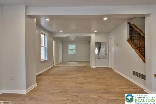 a view of a hallway with windows