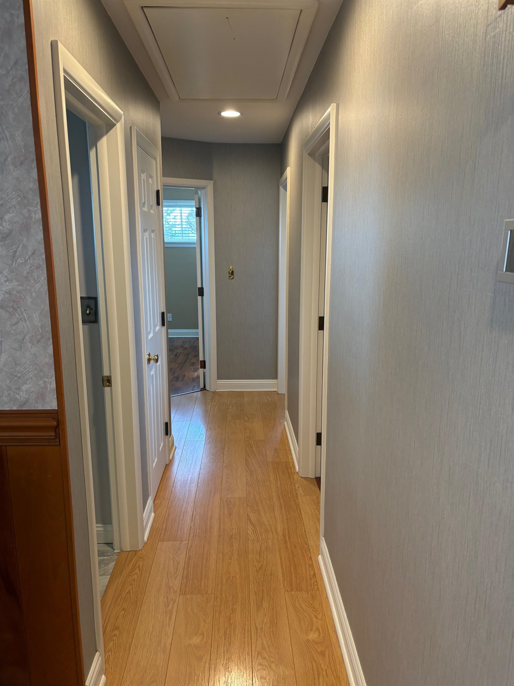 48 Confederate Street Verona, VA 24482 - Photo 15 of 47 a view of a hallway with wooden floor and a bathroom