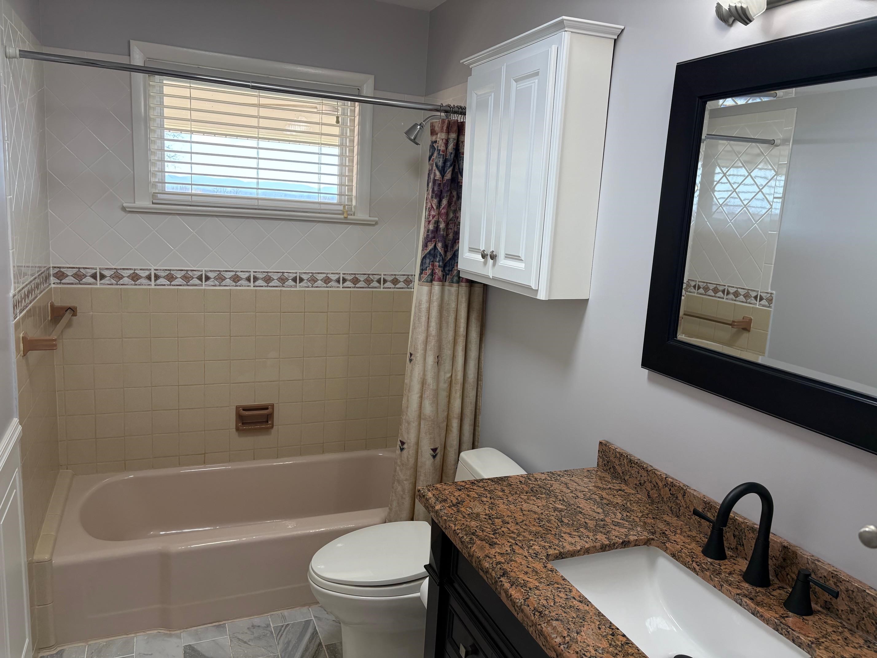 48 Confederate Street Verona, VA 24482 - Photo 17 of 47 a bathroom with a granite countertop sink toilet and shower