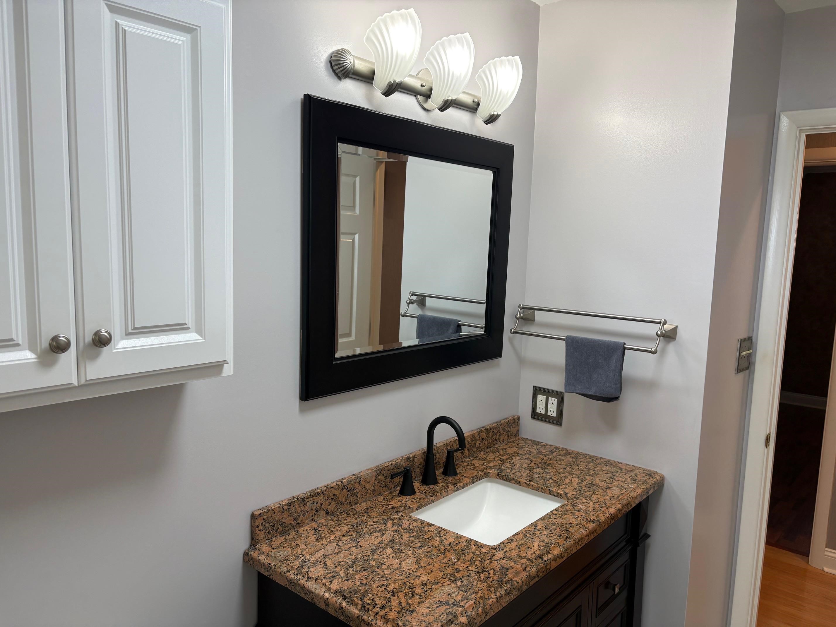 48 Confederate Street Verona, VA 24482 - Photo 19 of 47 a bathroom with a sink and a mirror