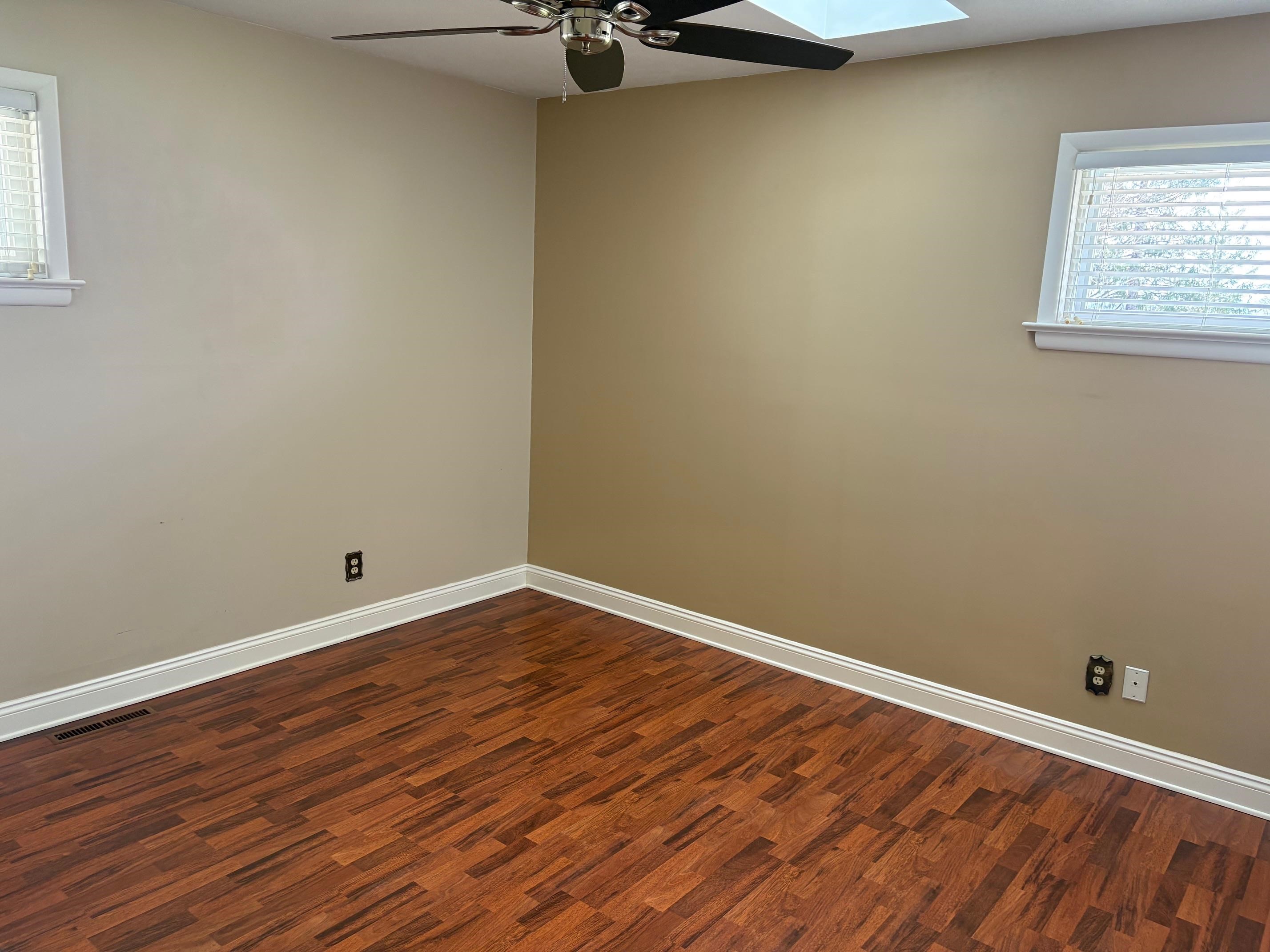 48 Confederate Street Verona, VA 24482 - Photo 22 of 47 a view of an empty room with wooden floor and a window