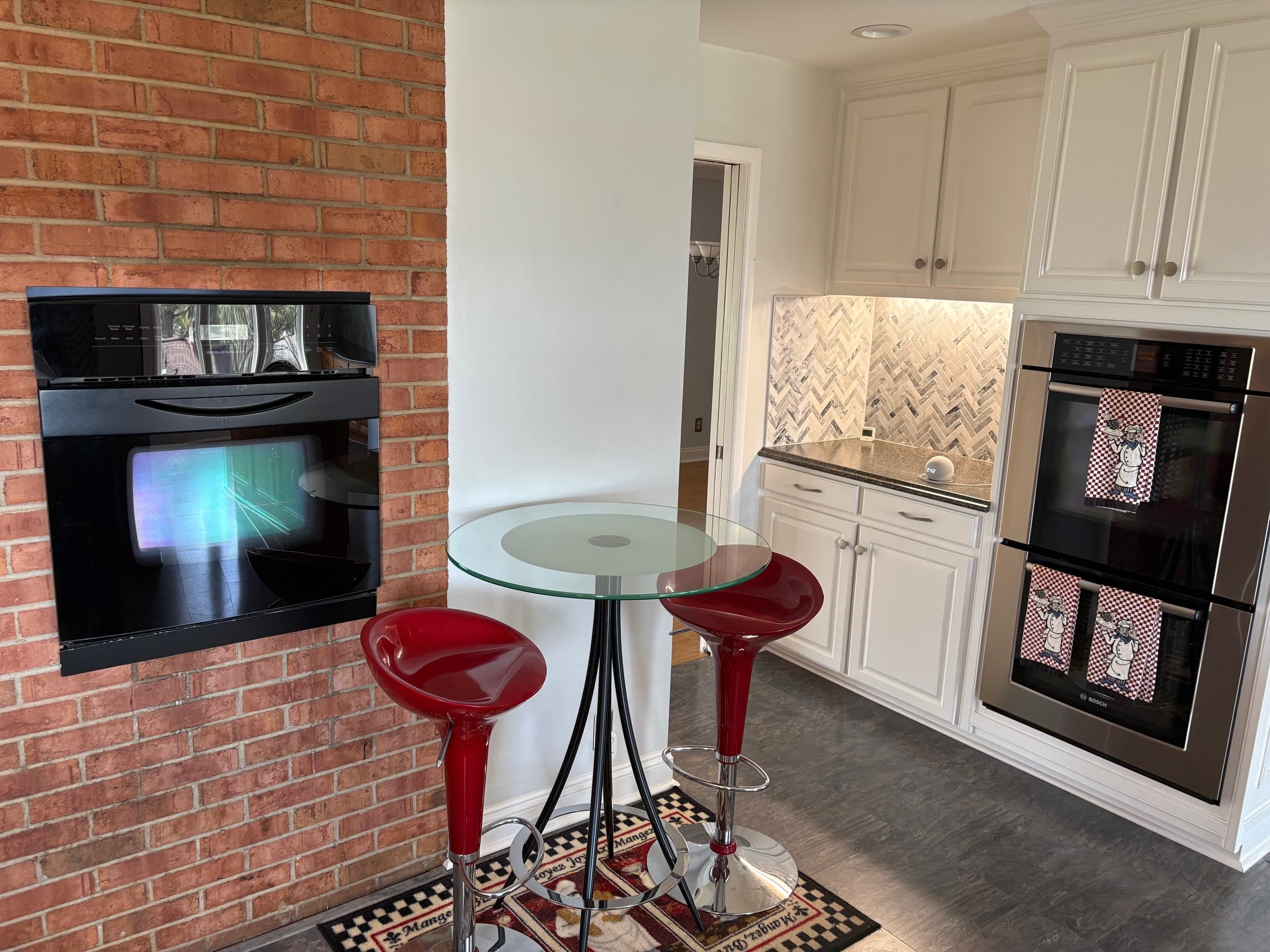 48 Confederate Street Verona, VA 24482 - Photo 5 of 47 a kitchen with stainless steel appliances kitchen island granite countertop a stove a refrigerator a sink with a dining table and chair