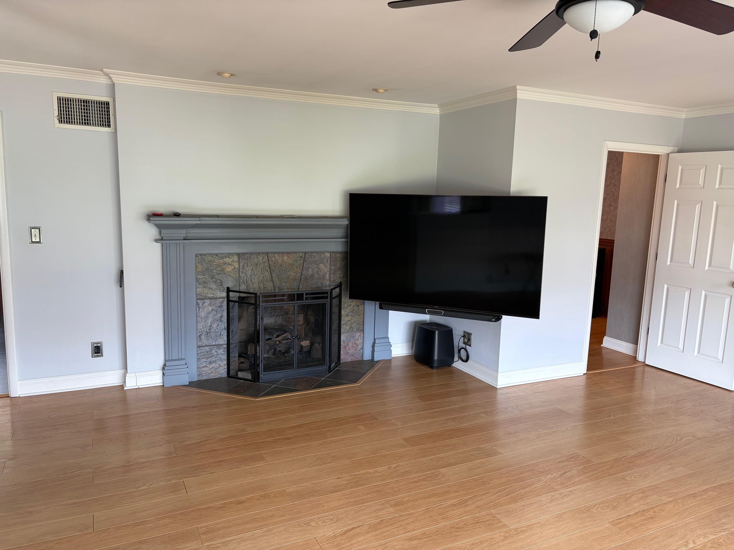 48 Confederate Street Verona, VA 24482 - Photo 6 of 47 a living room with a flat screen tv and a fireplace