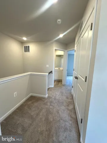 a bathroom with a double vanity sink mirror and shower