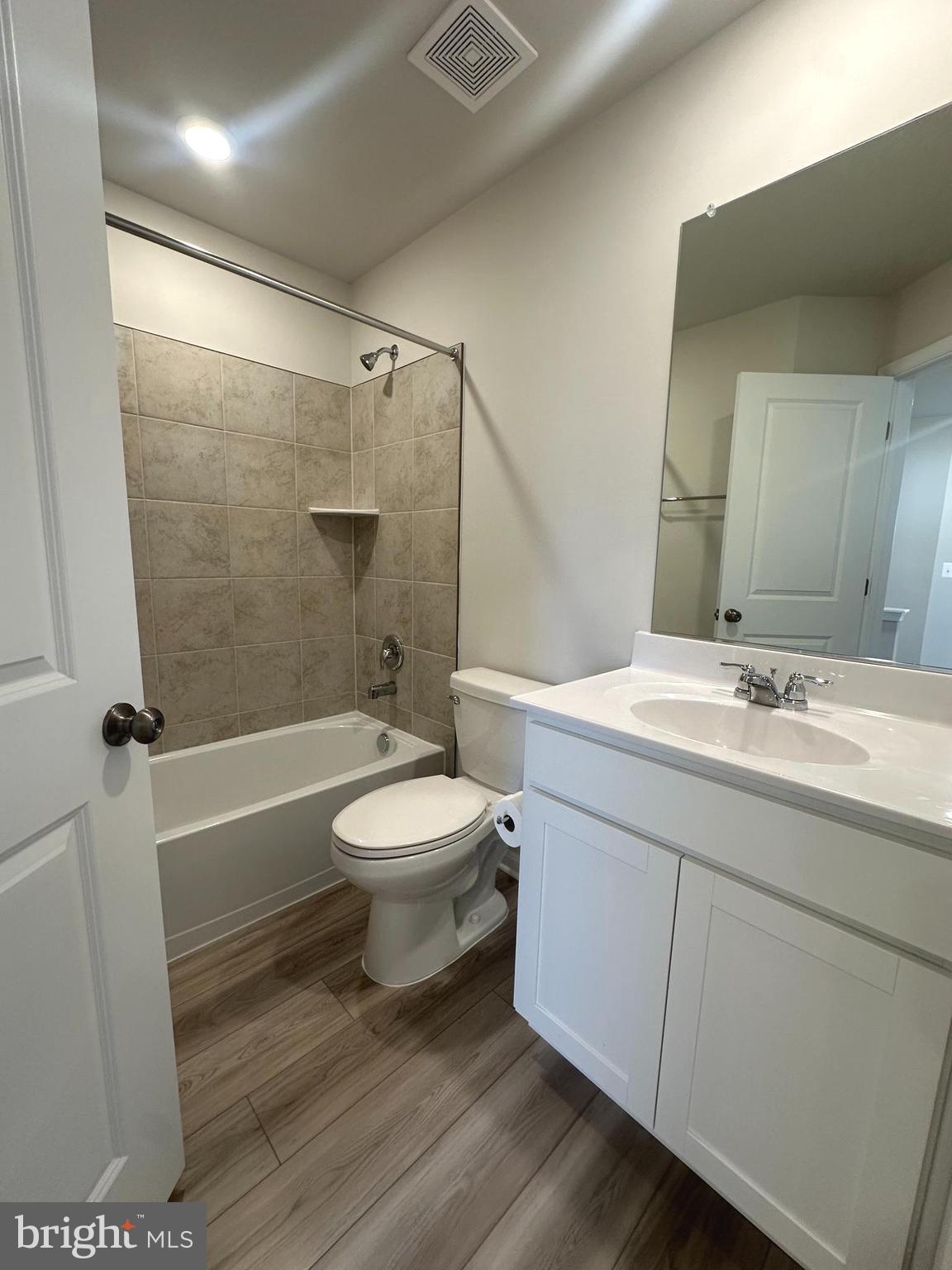 106 Telluride Way Charles Town, WV 25414 - Photo 19 of 55 a bathroom with a sink a toilet and a large mirror