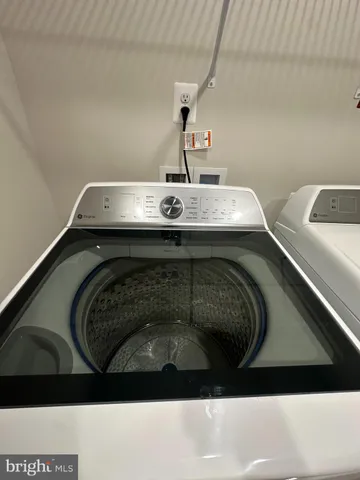a utility room with washer and dryer