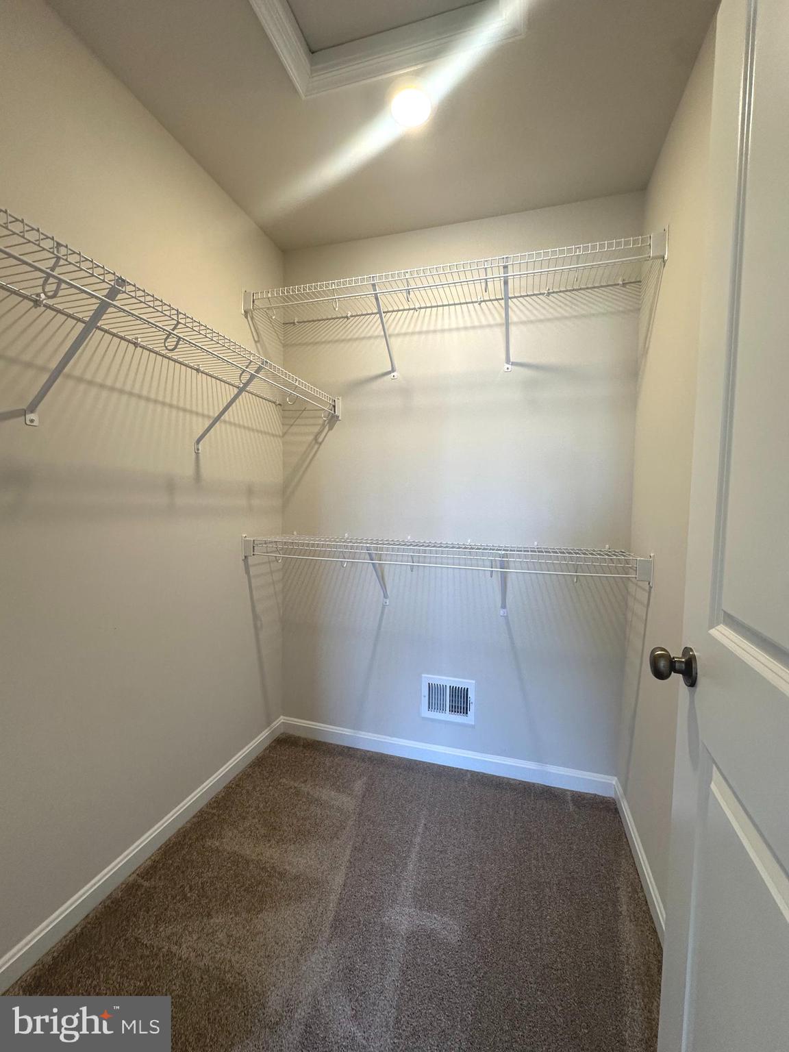 106 Telluride Way Charles Town, WV 25414 - Photo 30 of 55 a view of a room with racks on the wall