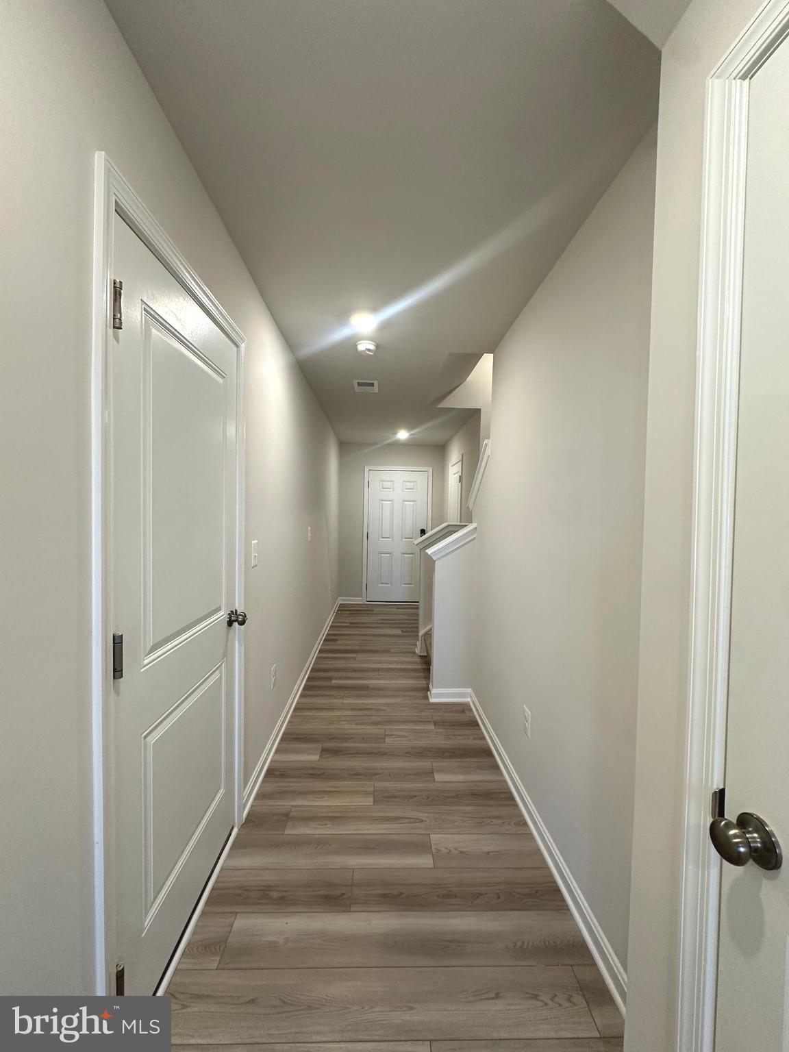 106 Telluride Way Charles Town, WV 25414 - Photo 36 of 55 a view of a hallway with wooden floor and staircase