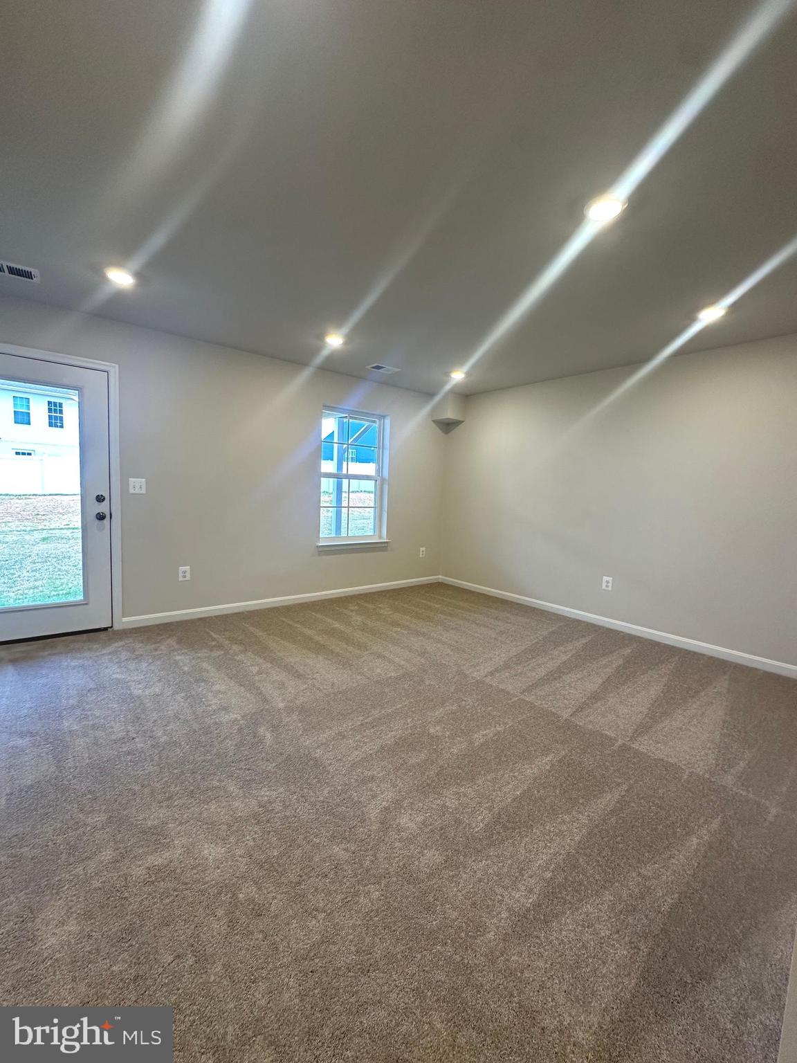 106 Telluride Way Charles Town, WV 25414 - Photo 39 of 55 an empty room with windows