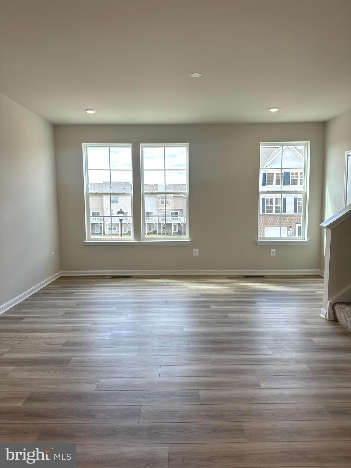 106 Telluride Way Charles Town, WV 25414 - Photo 42 of 55 a view of an empty room with wooden floor and a window