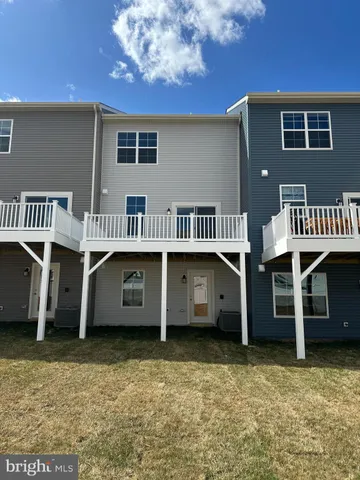 a view of balcony with wooden floor