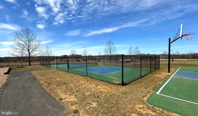 a view of a big yard with an outdoor seating
