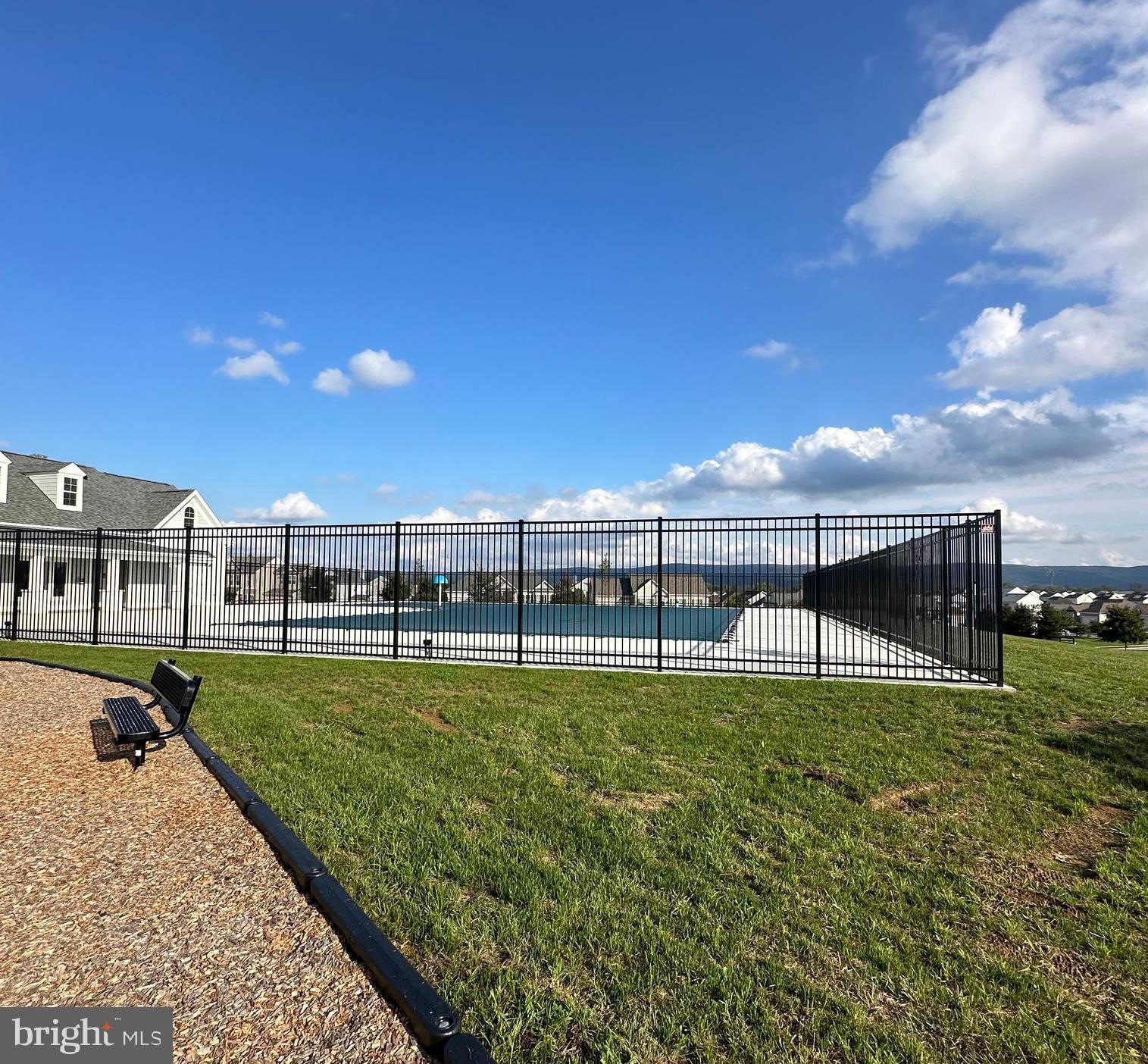106 Telluride Way Charles Town, WV 25414 - Photo 53 of 55 a view of a swimming pool with a garden and deck