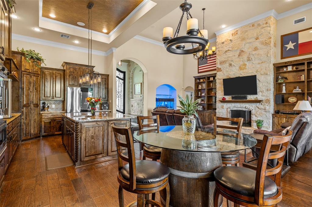 241 Chapman Road Hewitt, TX 76643 - Photo 8 of 40 Kitchen with breakfast area and bar