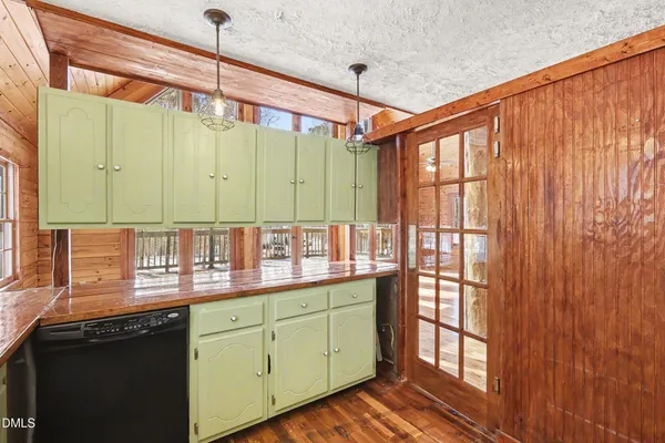 a kitchen with stainless steel appliances a refrigerator stove and microwave