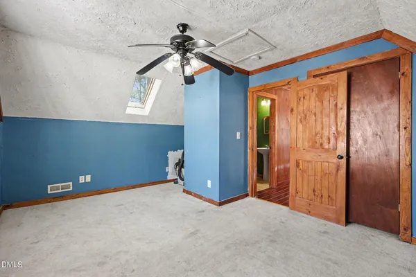 a view of backyard with deck and wooden floor