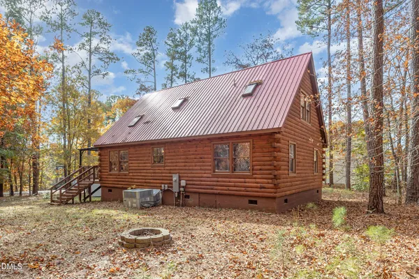 a view of outdoor space with wooden floor and barbeque oven