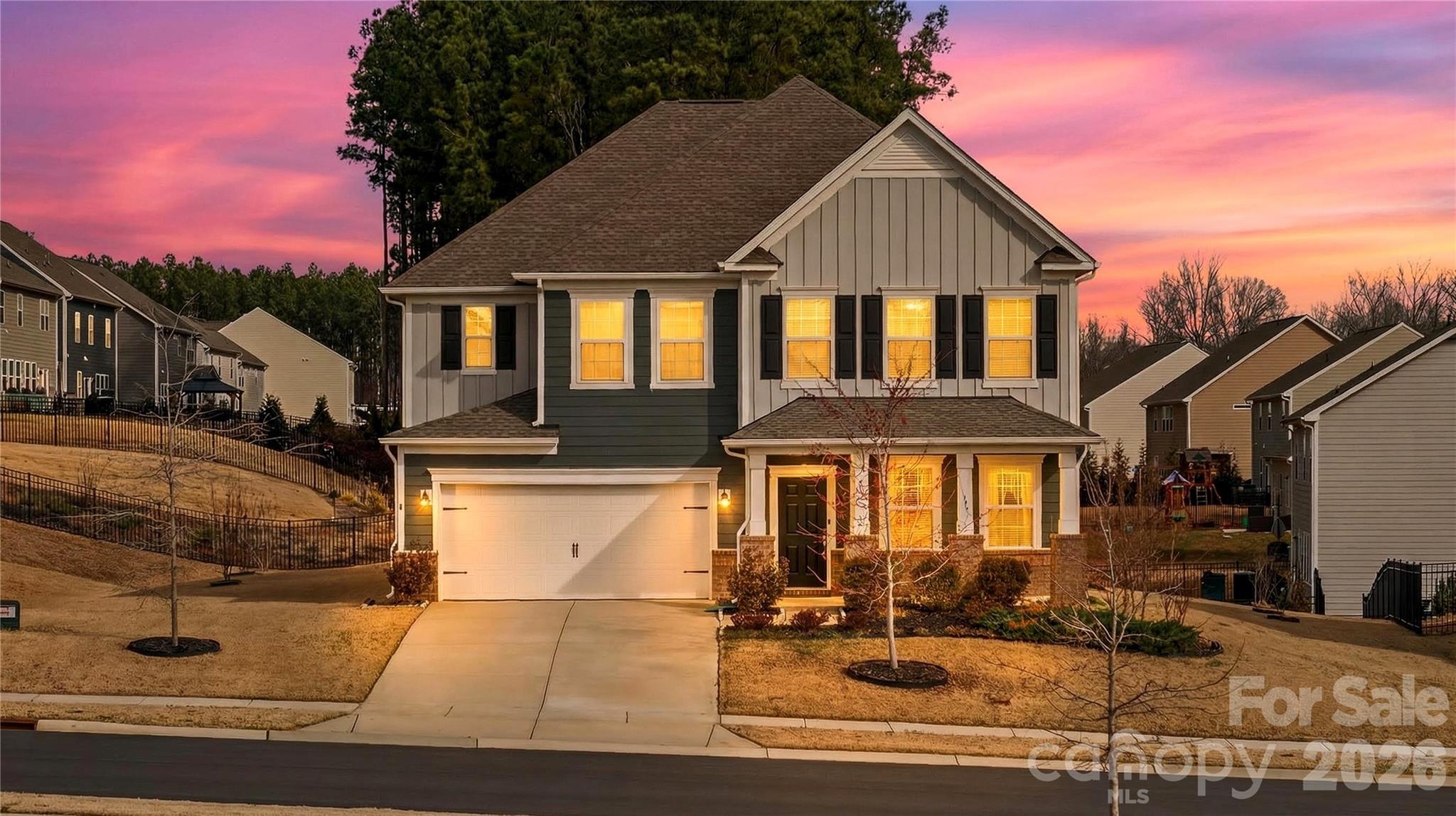 151 Outrigger Lane Troutman, NC 28166 - Photo 1 of 39 a front view of a house with garden