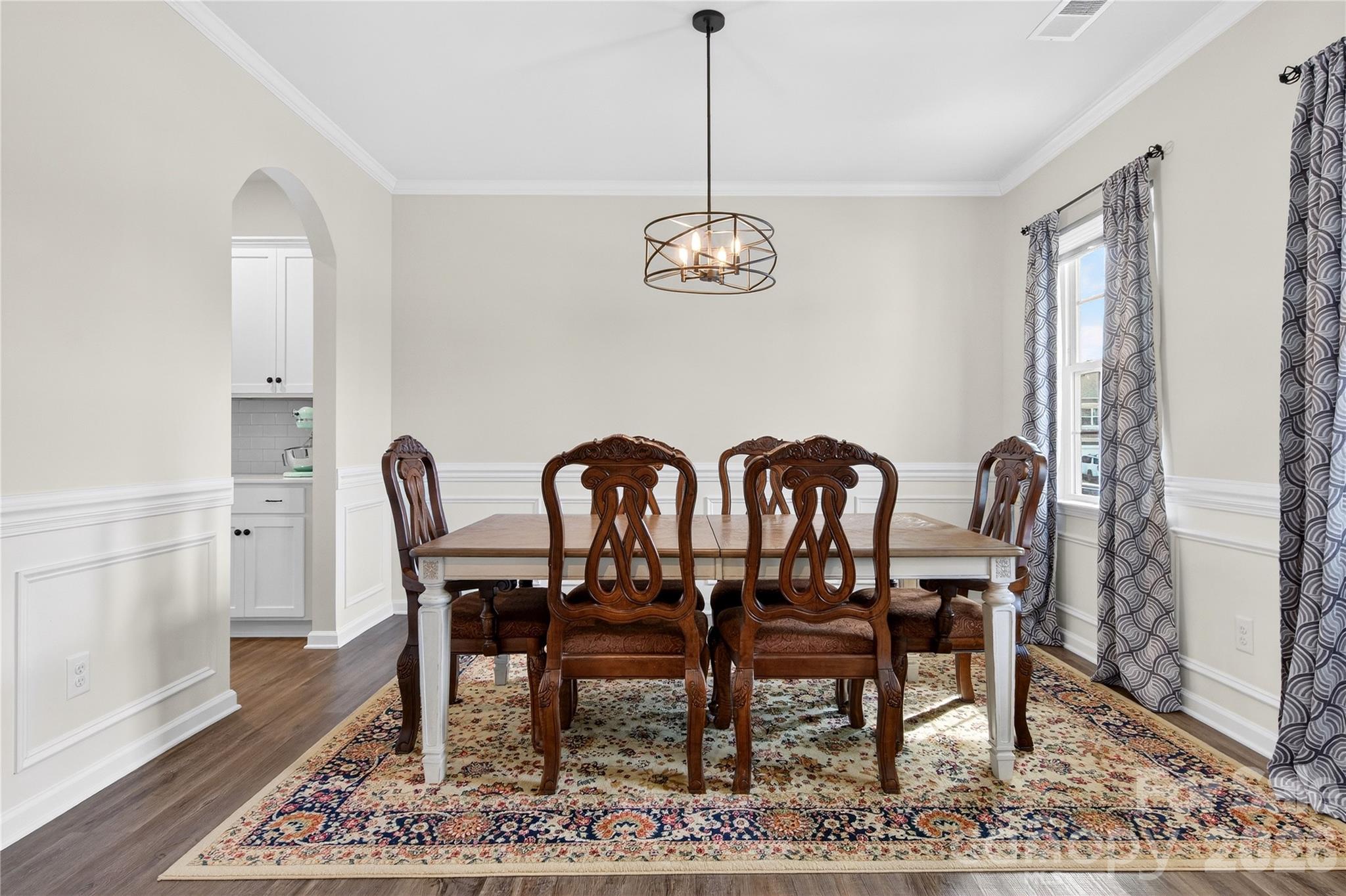 151 Outrigger Lane Troutman, NC 28166 - Photo 12 of 39 a view of a dining room with furniture window and wooden floor