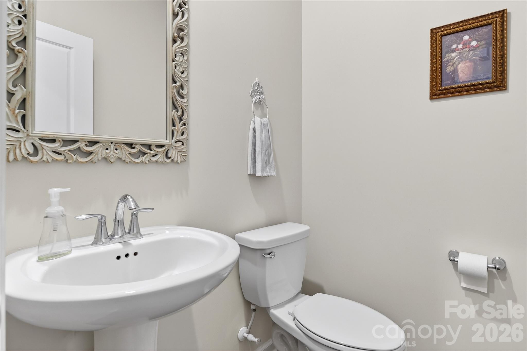 151 Outrigger Lane Troutman, NC 28166 - Photo 14 of 39 a bathroom with a toilet sink and mirror